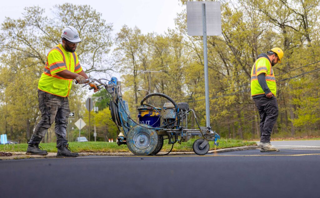 Earle American crew lays down precise stripes on parking lot