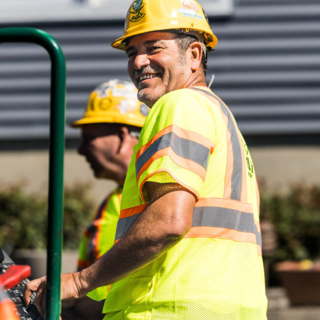 Earle American employees sealing blacktop