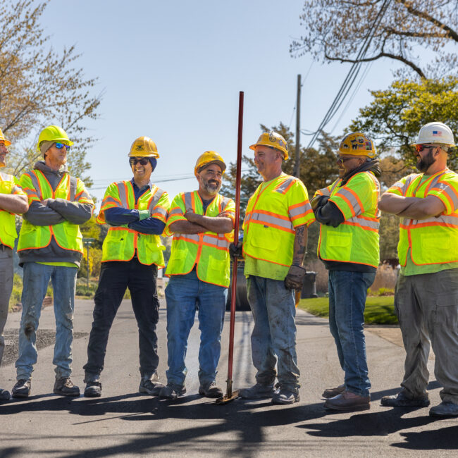 Earle American team members smiling at job site