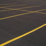 Newly paved parking lot with freshly painted lines