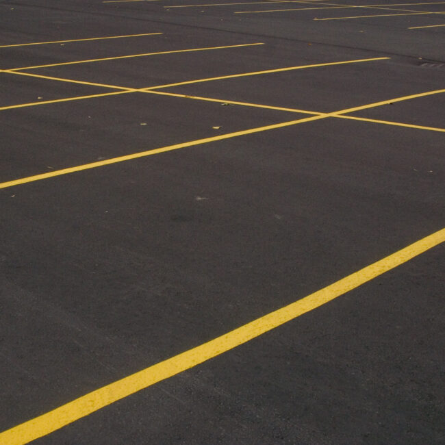 Newly paved parking lot with freshly painted lines