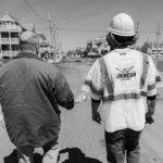 Paving contractor and property owner performing site evaluation