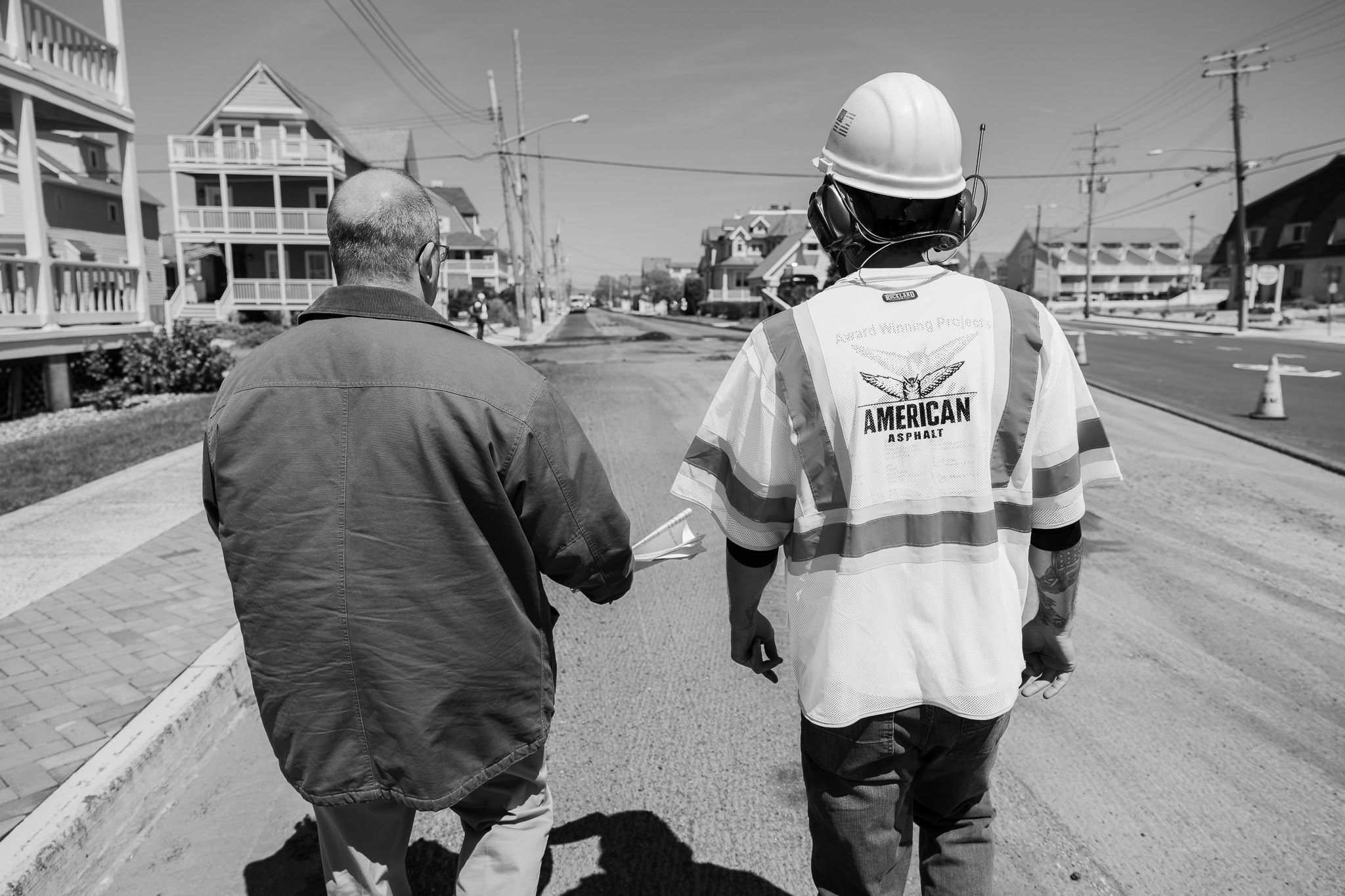 Paving contractor and property owner performing site evaluation