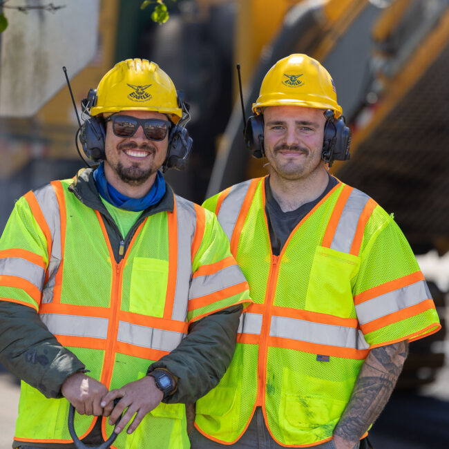 Paving contractors smiling at camera