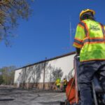 Work crew repairing commercial parking lot